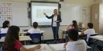 Diverse K-12 students and teacher in modern classroom