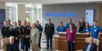 Veterans smiling in a modern VA medical center lobby, discussing health care options.